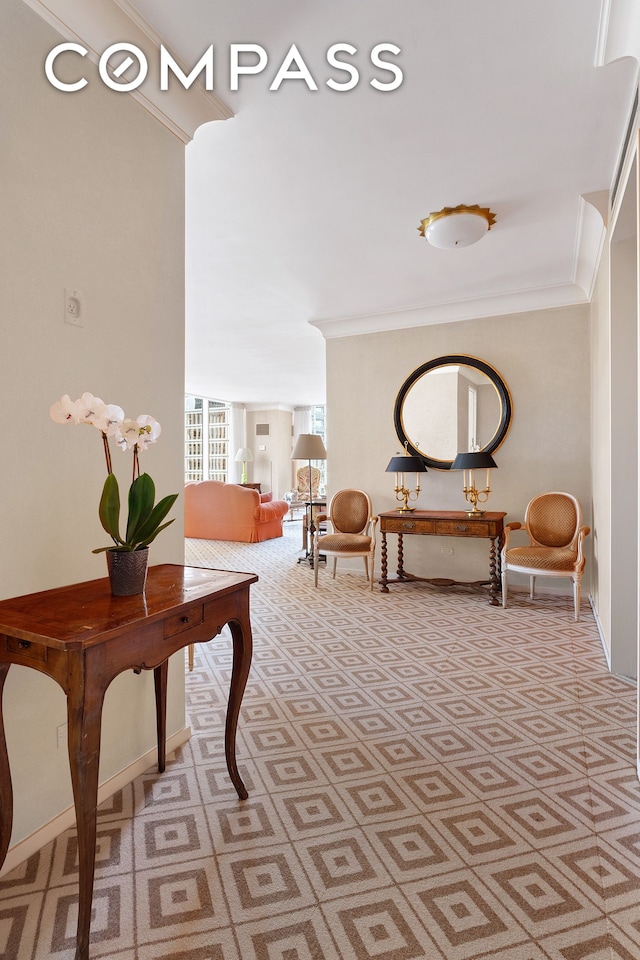 hallway with light carpet and ornamental molding