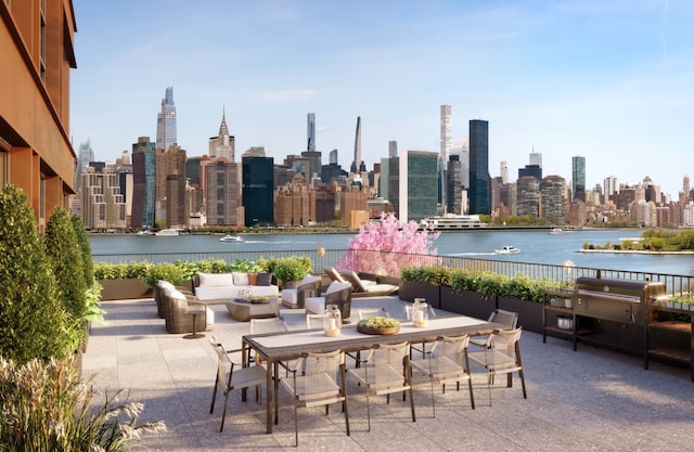 view of patio / terrace featuring a water view, outdoor dining area, an outdoor living space, and a city view