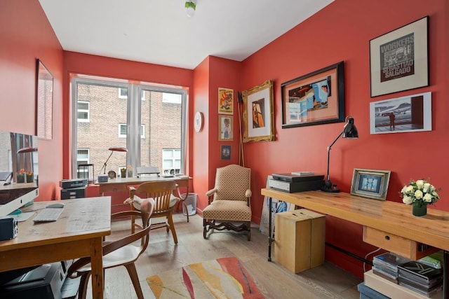 office area with light hardwood / wood-style flooring