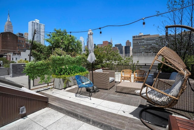 view of patio / terrace featuring a wooden deck and an outdoor hangout area