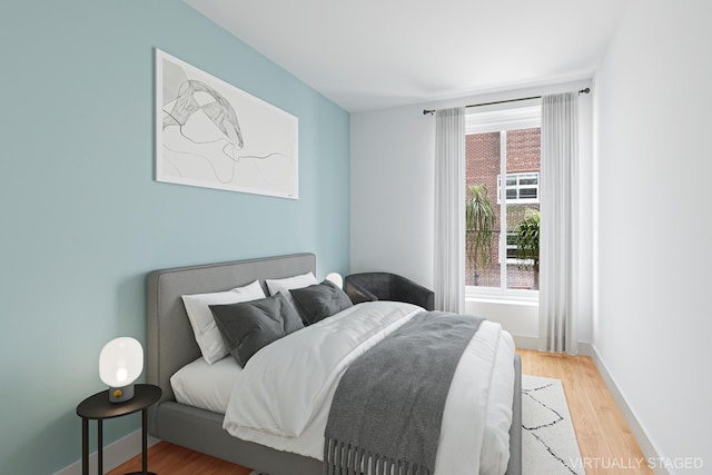 308 E 30th St Unit 1, New York City, NY 10016 - bedroom with light wood-style floors and baseboards