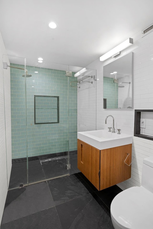 308 E 30th St Unit 1, New York City, NY 10016 - full bath featuring vanity, a stall shower, and tile walls