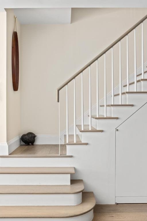 stairs with wood-type flooring