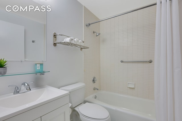 full bathroom featuring shower / tub combo, vanity, and toilet