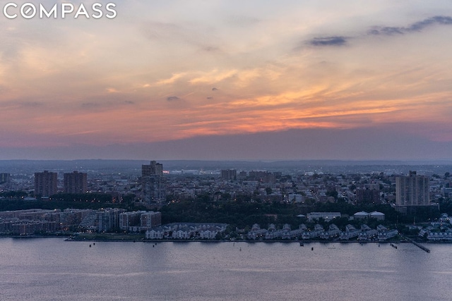 aerial view at dusk with a water view