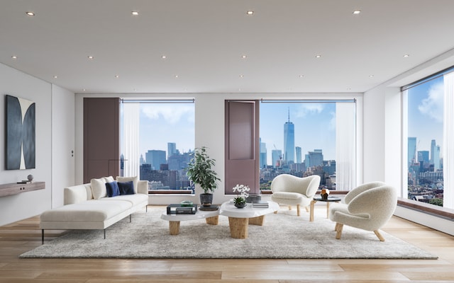 251 W 14th St Unit 2A, New York City, NY 10011 - living room featuring a view of skyline, wood finished floors, and plenty of natural light