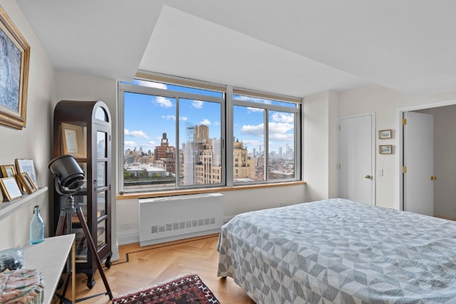2373 Broadway Unit 1903, New York City, NY 10024 - bedroom featuring radiator heating unit and a skyline view