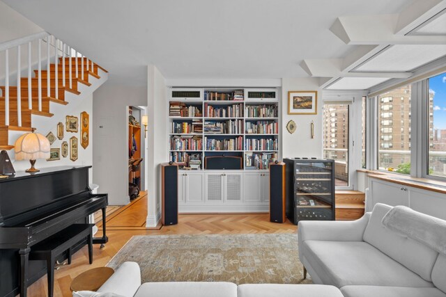 living area featuring hardwood / wood-style floors and radiator heating unit