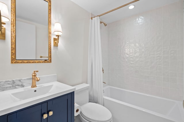 full bathroom featuring toilet, vanity, and shower / bath combination with curtain