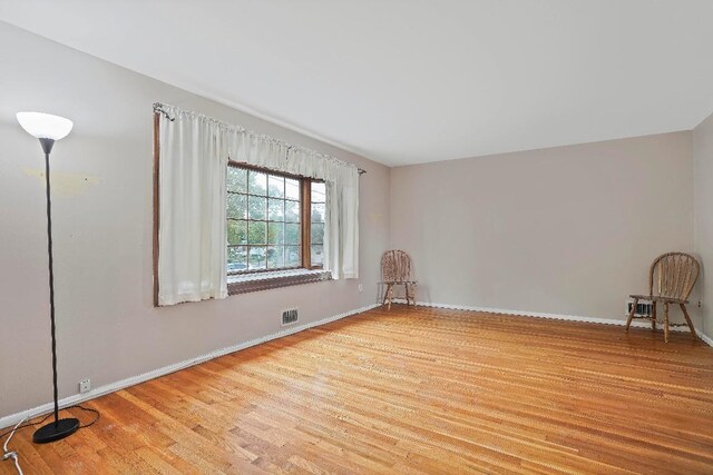 spare room with light wood-type flooring