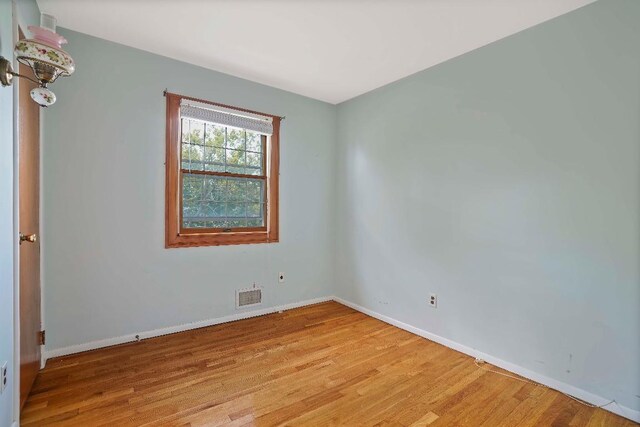 unfurnished room featuring light wood-type flooring