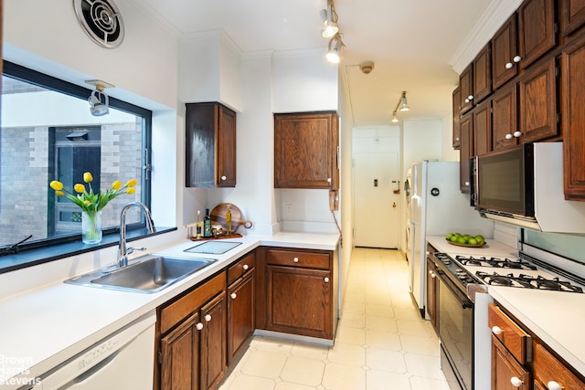 kitchen with dishwasher, sink, crown molding, and range with gas cooktop