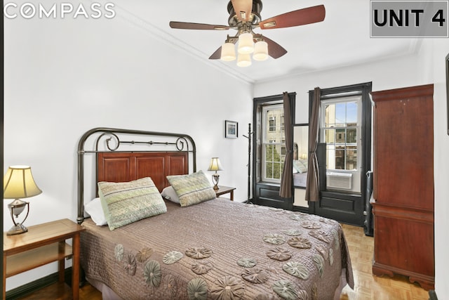 bedroom with ceiling fan, ornamental molding, and light parquet flooring