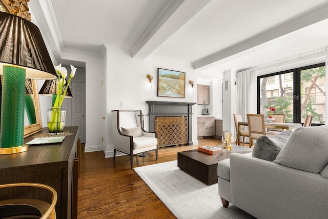 living room with beam ceiling, dark hardwood / wood-style floors, ornamental molding, and french doors