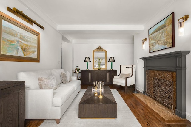 living room featuring dark hardwood / wood-style floors and crown molding