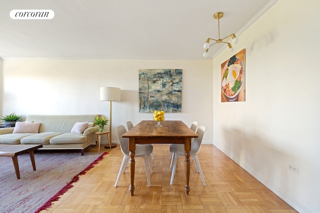 dining room with ornamental molding and light parquet floors