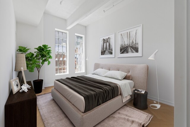 bedroom featuring beam ceiling