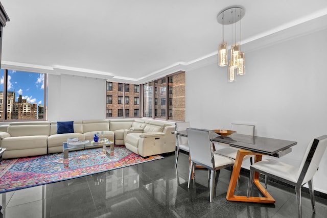 living room featuring a chandelier and granite finish floor