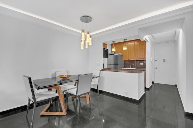235 E 40th St Unit 24H, New York City, NY 10016 - dining room with baseboards and a tray ceiling