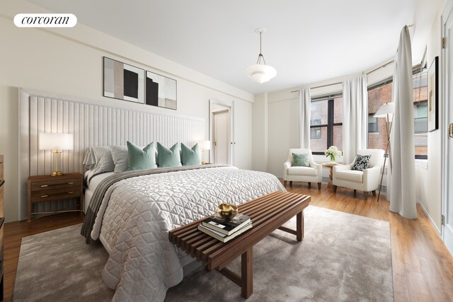 bedroom with wood finished floors and visible vents