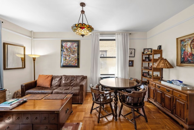 dining space featuring light parquet floors