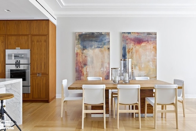 dining area with light parquet flooring