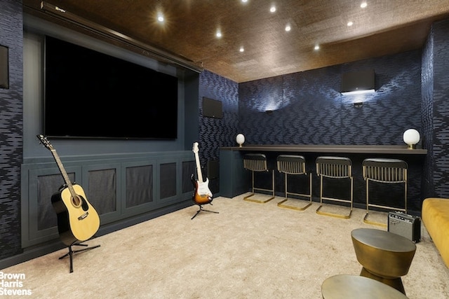 carpeted cinema with recessed lighting and wallpapered walls