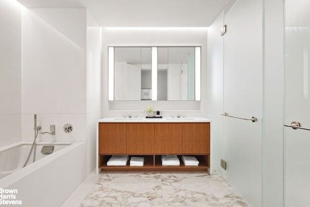 bathroom featuring vanity and a bathing tub