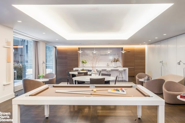 recreation room with pool table, a raised ceiling, dark wood-style floors, and recessed lighting