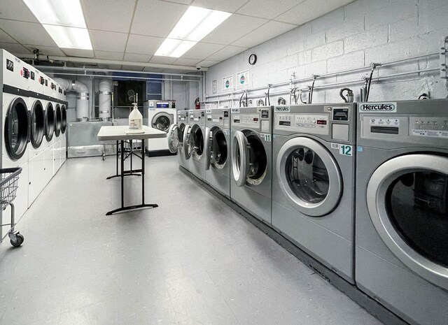 clothes washing area with washer and dryer