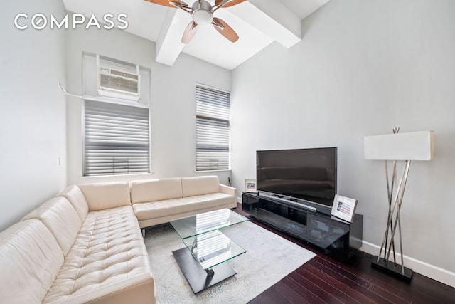 living room with ceiling fan, beamed ceiling, dark wood finished floors, and baseboards