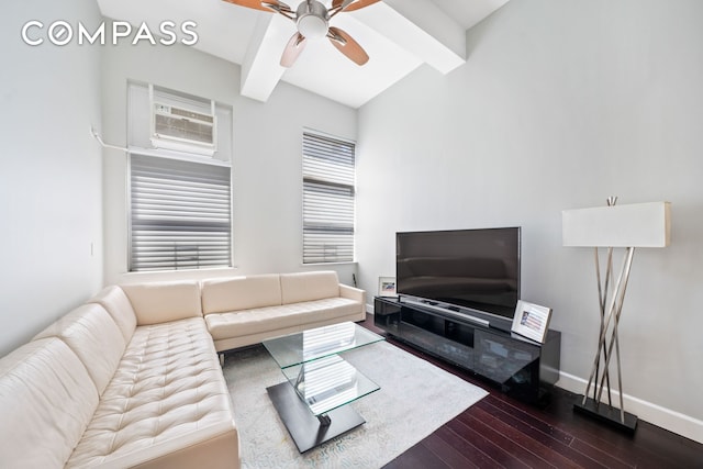 living room with dark wood finished floors, beam ceiling, a ceiling fan, and baseboards