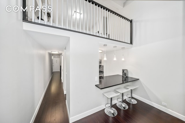 350 E 62nd St Unit 4L, New York City, NY 10065 - hall featuring wood-type flooring, baseboards, and a high ceiling