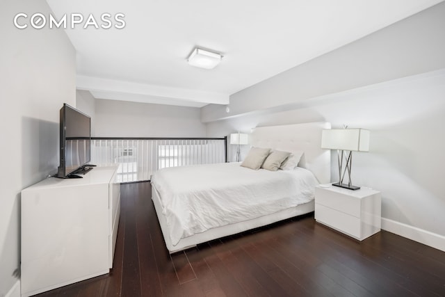 350 E 62nd St Unit 4L, New York City, NY 10065 - bedroom with baseboards, beam ceiling, and dark wood-style floors