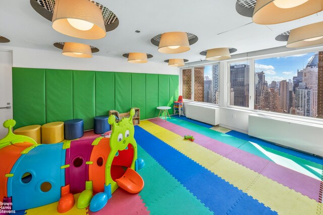 322 W 57th St Unit 35U1, New York City, NY 10019 - playroom with a city view