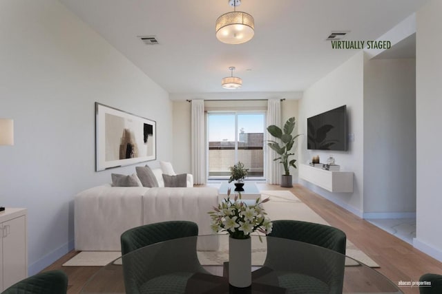 living room with light hardwood / wood-style floors