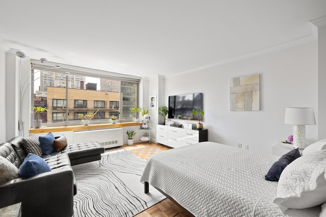 bedroom with ornamental molding and radiator heating unit