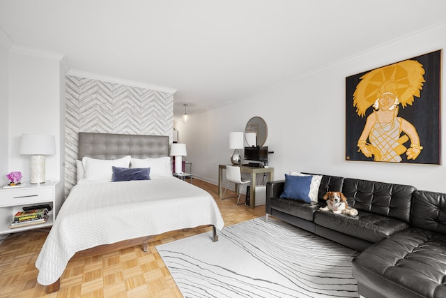 bedroom with baseboards, an accent wall, and crown molding