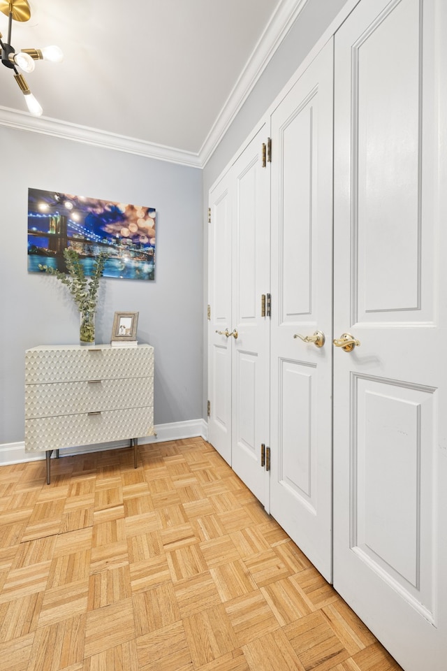 hallway featuring baseboards and ornamental molding