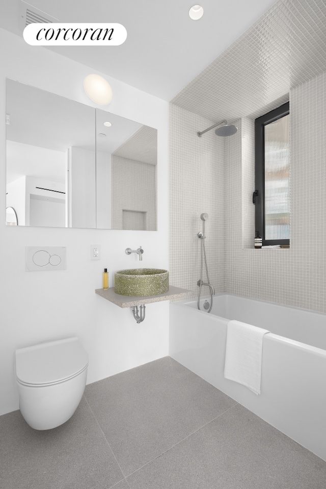 bathroom with recessed lighting, a sink, and toilet