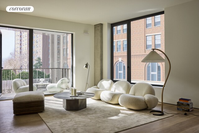 bedroom with hardwood / wood-style flooring and multiple windows