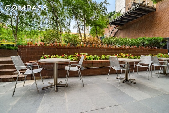 view of patio / terrace with outdoor dining space and fence