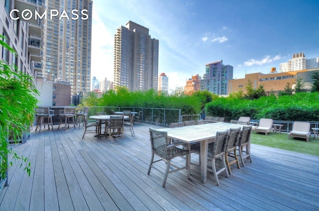 515 E 72nd St Unit 3Klmn, New York City, NY 10021 - deck with outdoor dining area and a view of skyline