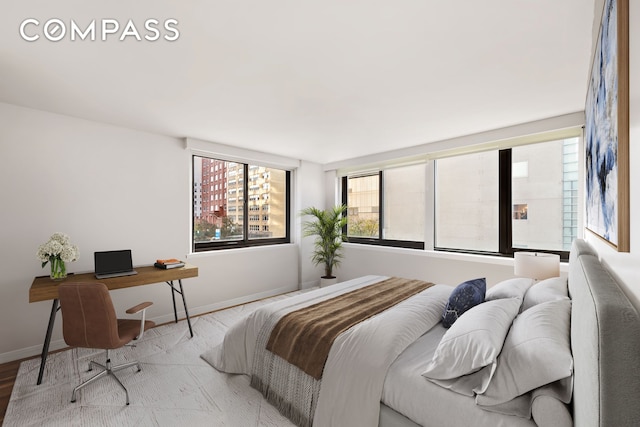 515 E 72nd St Unit 3Klmn, New York City, NY 10021 - bedroom featuring baseboards and a desk