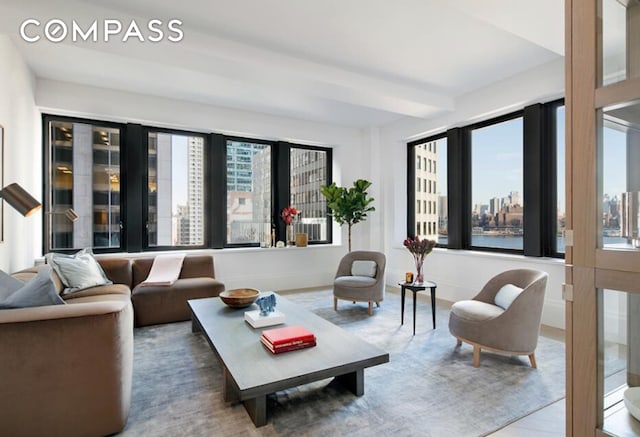 living room with a city view and beam ceiling