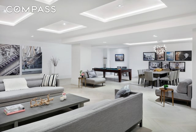 living area featuring pool table, baseboards, and an inviting chandelier