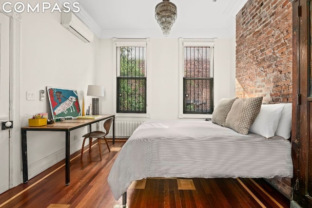 bedroom featuring ornamental molding, radiator heating unit, a wall unit AC, and hardwood / wood-style floors