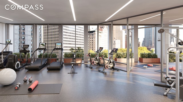 exercise room with a wall of windows and a city view