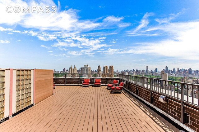 wooden terrace with a view of city