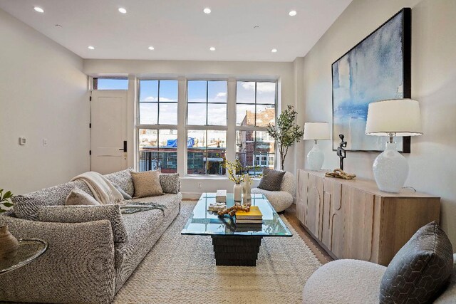 foyer featuring a wealth of natural light and light hardwood / wood-style flooring